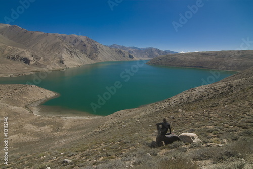 Tourist at the Yashil Kul lake, The Pamirs, Tajikistan photo