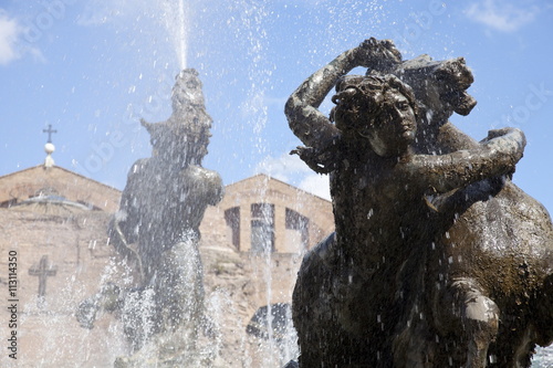 The Fountain of the Naiads in the Piazza della Repubblica and St. Mary of the Angels and of the Martyrs church and Diocletian Baths in the background, Rome, Lazio photo