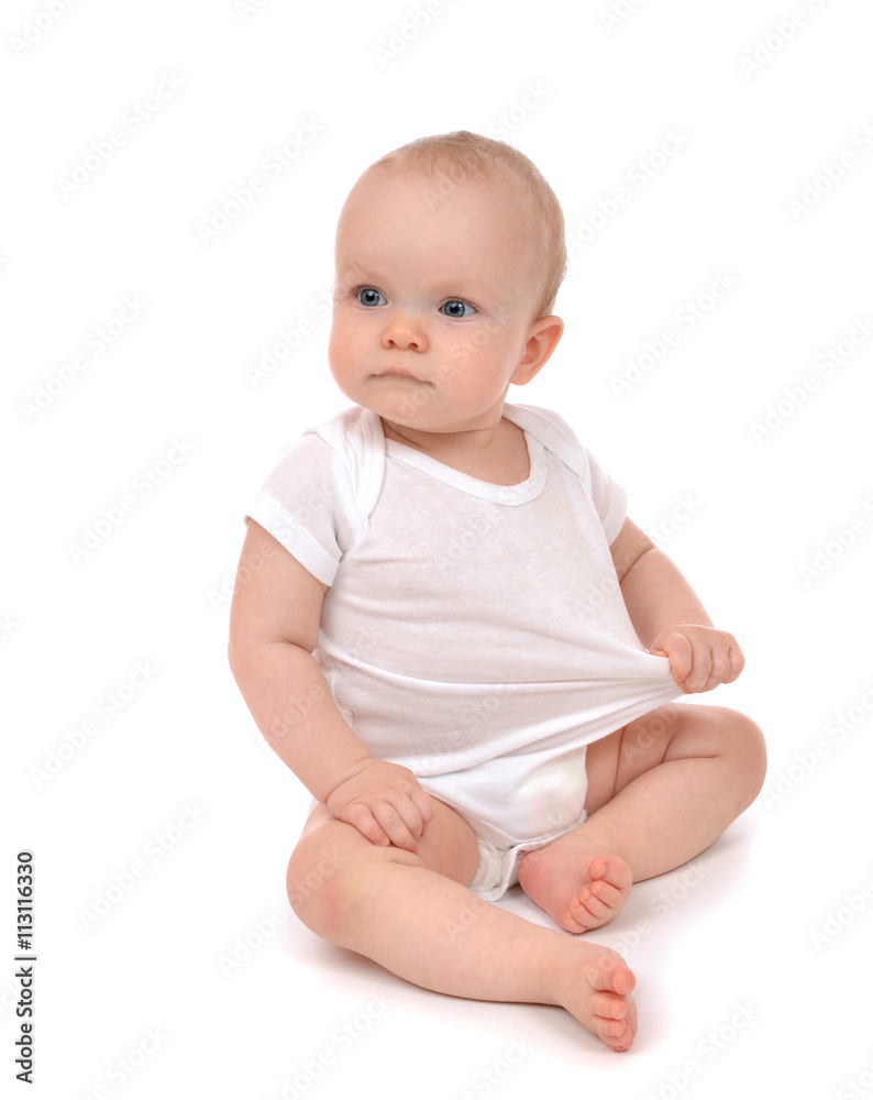 Infant child baby girl in diaper sitting and happy looking at th Infant child baby girl in diaper sitting and happy looking at th
