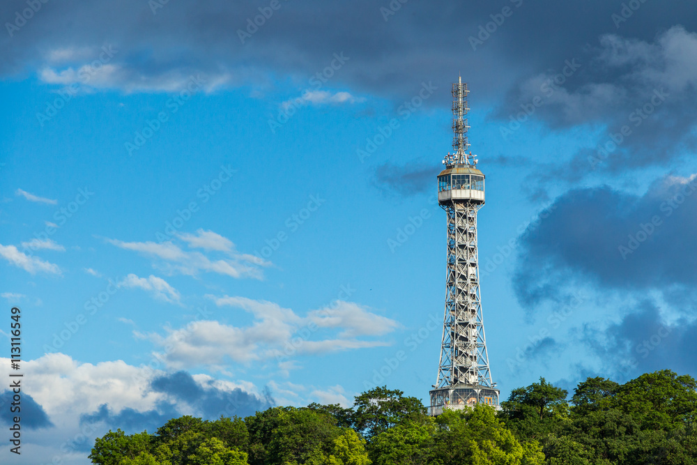Obraz premium Lookout tower on the Petrin Hill in flowering spring park