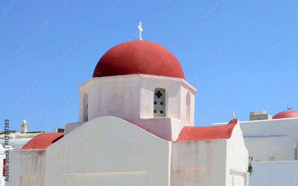 A white church with red roof on Mykonos island, Greece