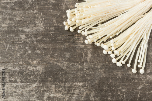  enoki mushroom,  golden needle mushroom on pine wooden table