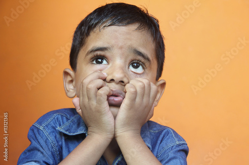 Portrait of Indian Boy Looking up photo