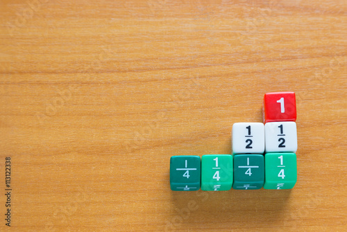 Color fraction dices on wood table