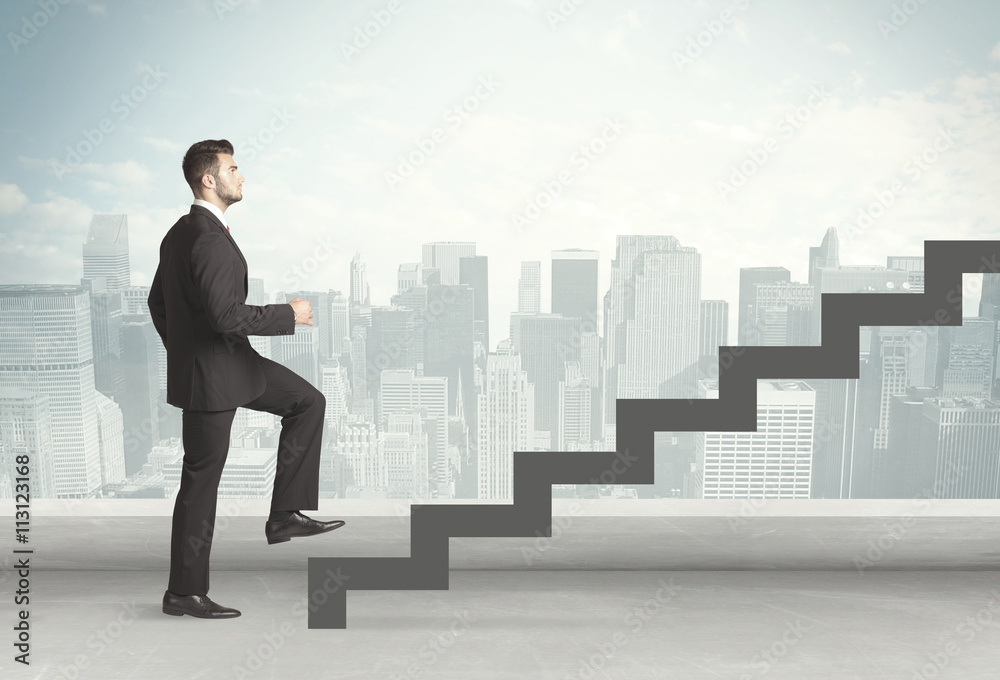 Business person in front of a staircase Business person in front of a staircase