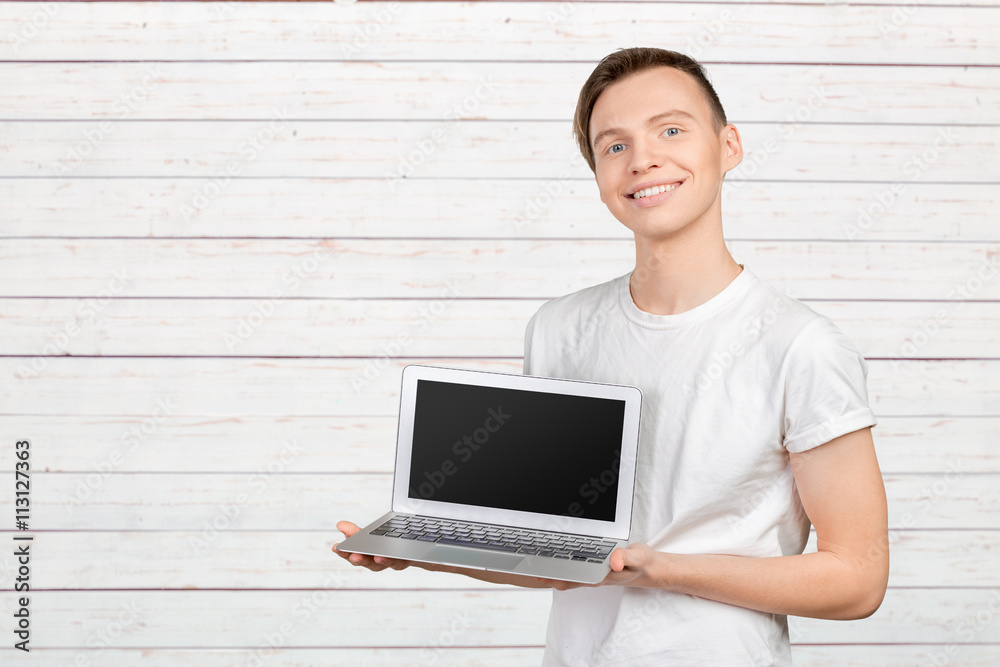 Happy young man with laptop Happy young man with laptop