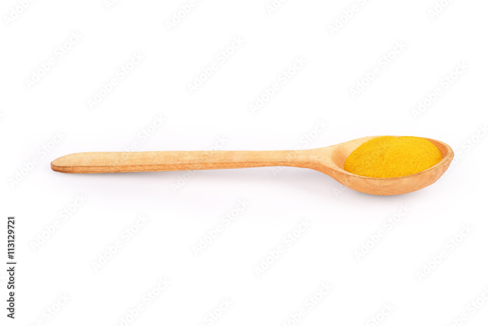 spices in a wooden spoon on a white background spices in a wooden spoon on a white background