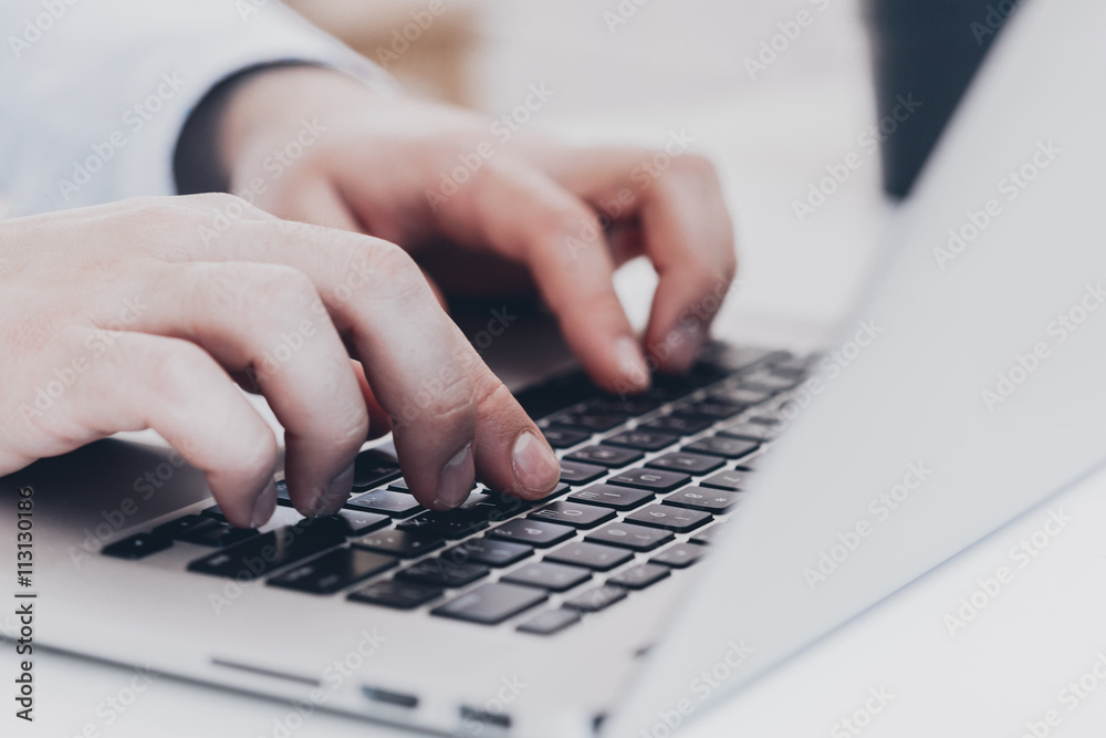 Businessman at work. Close-up top view of man working on laptop Businessman at work. Close-up top view of man working on laptop