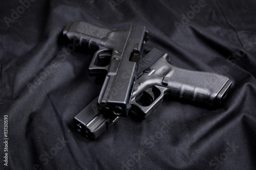 handgun on black background