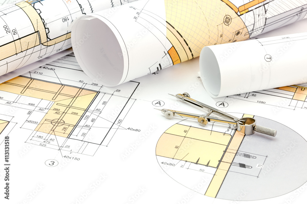 architects workspace with blueprint, rolls and drawing compass architects workspace with blueprint, rolls and drawing compass