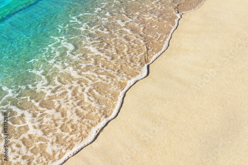 Soft ocean wave on the sandy beach