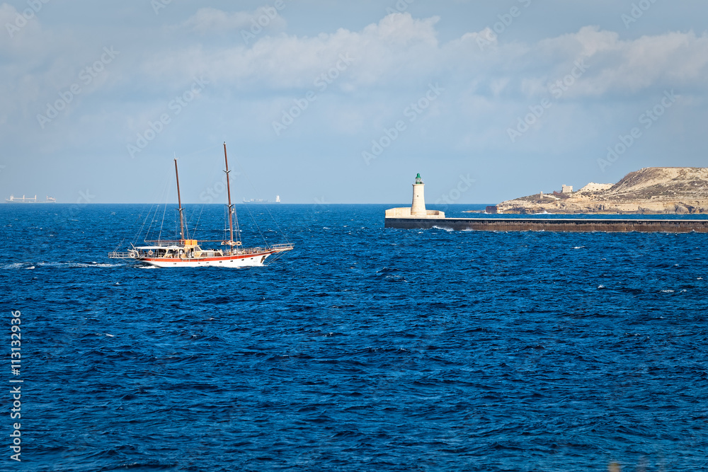 Sailing ship enters the harbor of Sliema (Malta)