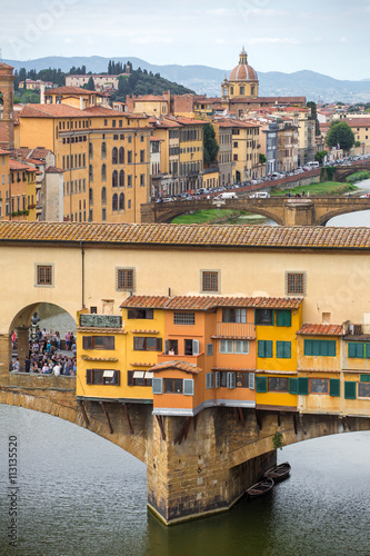 View of the beautiful city Florence with amazing bridge Ponte Vecchio a and Arno river,Tuscany, Italy. Travel destination.