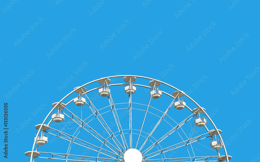 Ferris wheel against blue sky.