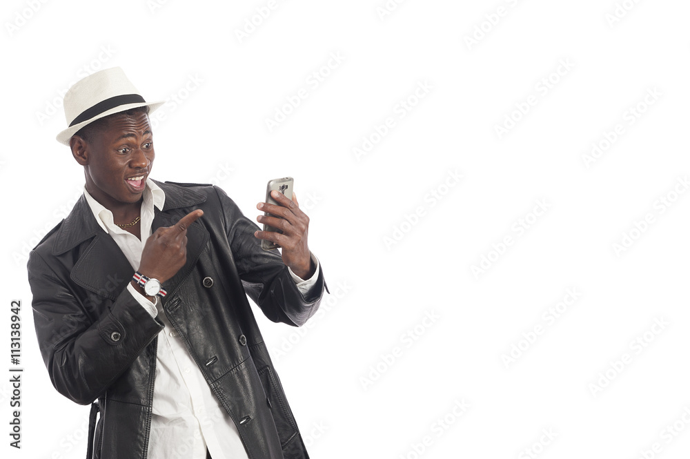Young African American man with a cell phone isolated on white background Young African American man with a cell phone isolated on white background