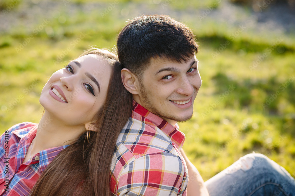 Portrait of a happy couple laughing at camera grass background close up Portrait of a happy couple laughing at camera grass background close up