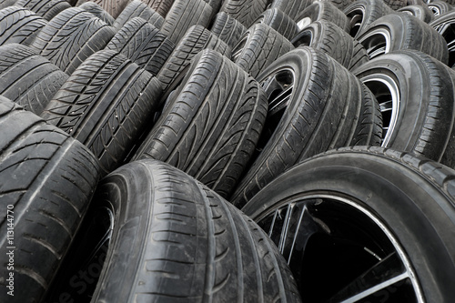 Close up stacks of old used tires for sale