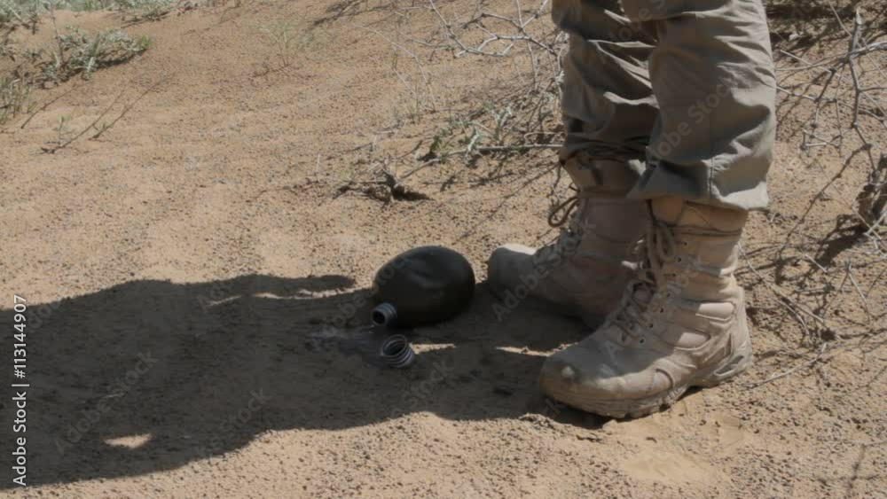 The tired traveler in the desert drops a flask with the last water
The tired traveler in the desert drops a flask with the last water