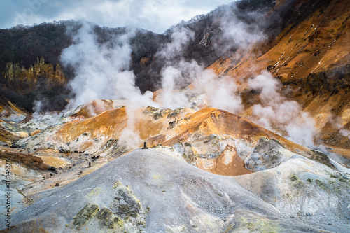 Jigokudani or Hell Valley in Noboribetsu, selective focus at volcano, Hokkaido, Japan photo