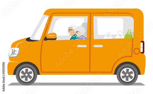 Senior Couple riding the Orange color car ,Side view - Isolated