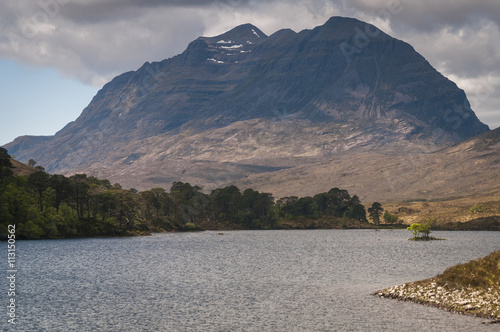 Scotland. Highlands. May 2016. A landscape format photograph of the dark foreboding mountain  that is Liathach from across  Loch Clair. Liathach situated in Glen Torridon in the Scottish Highlands photo