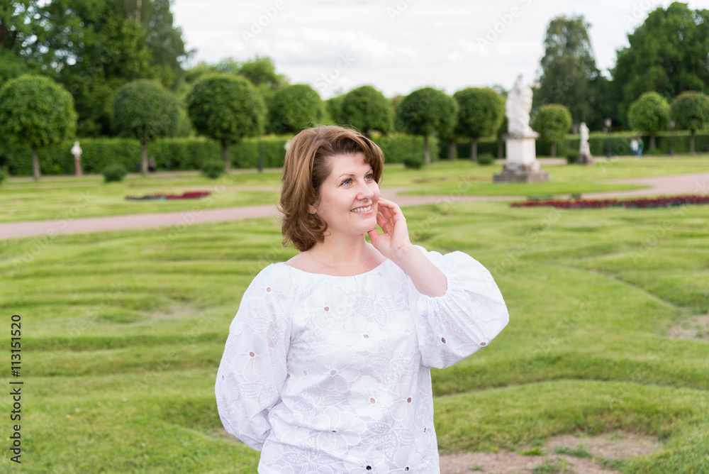 Portrait of positive woman in a white blouse Portrait of positive woman in a white blouse