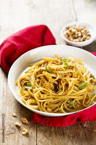 Pasta with spicy chicken, lemon and nuts