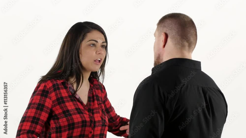 Furious woman swears with her man and waving her arms. White Furious woman swears with her man and waving her arms. White