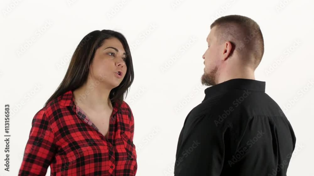 Woman screaming at man and beating his fists on chest. White Woman screaming at man and beating his fists on chest. White