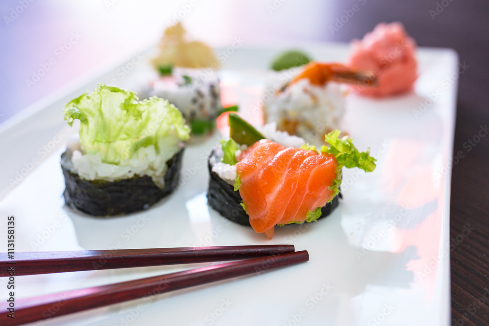 Sushi set with chopsticks on the plate Sushi set with chopsticks on the plate