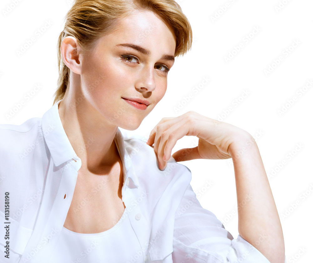 Charming young fashion model in white shirt on white background. Youth and skin care concept Charming young fashion model in white shirt on white background. Youth and skin care concept