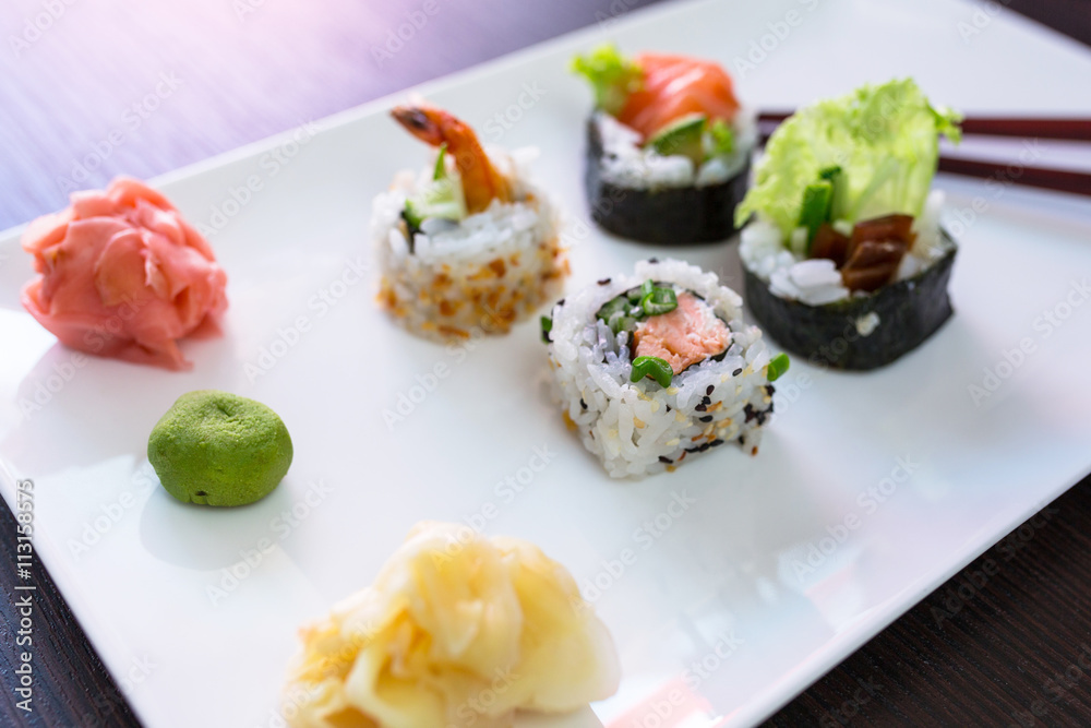 Sushi set with chopsticks on the plate Sushi set with chopsticks on the plate