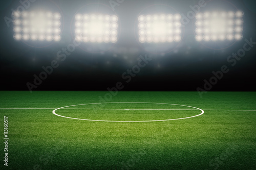 empty football field with stadium at night