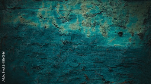 Dark wooden boards with a dark turquoise shade use for background. © avtk