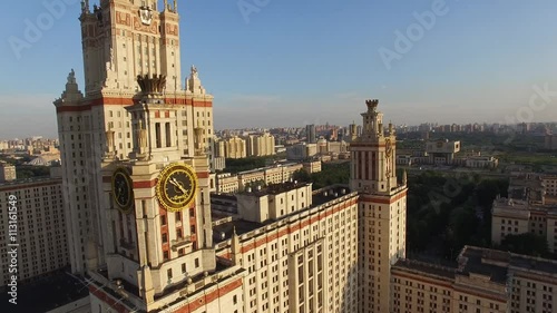 Helicopter flight over MSU Moscow State University. Close approach to clock. Moscow city center and Luzhniki stadium at background. Ultra HD 4K. Best footage.
