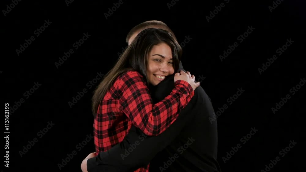 Warm and gentle hugs of couple after quarrel and scandals. Black Warm and gentle hugs of couple after quarrel and scandals. Black