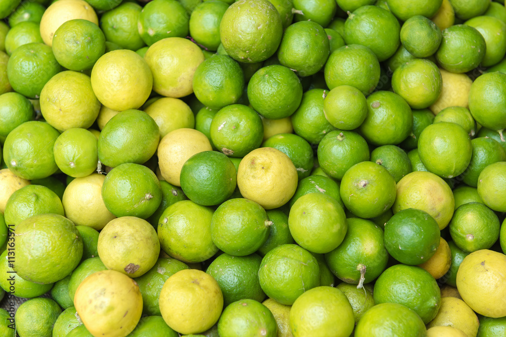 Stack of limes on display at farmers market Stack of limes on display at farmers market
