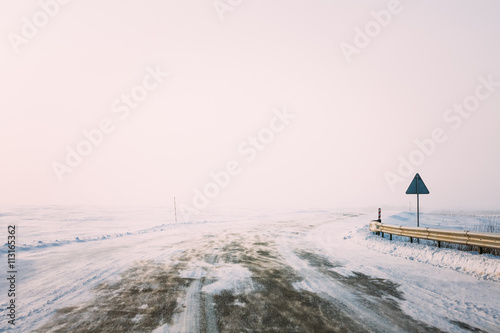 Snow-covered Road During A Snowstorm In Winter. Open Road,