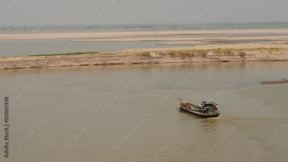 Motor boat on Irrawaddy river in Myanmar Motor boat on Irrawaddy river in Myanmar