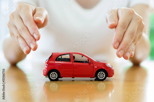 woman holding model of car in his hands, closeup