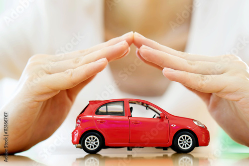 Female hands and car as protection of car concept