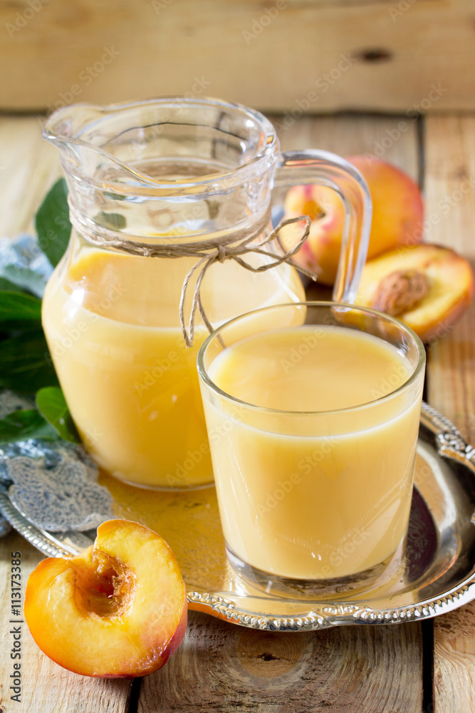 Milkshake is made from peach, mixed with kefir yogurt.