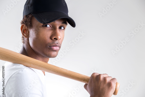 Black man holding bat
