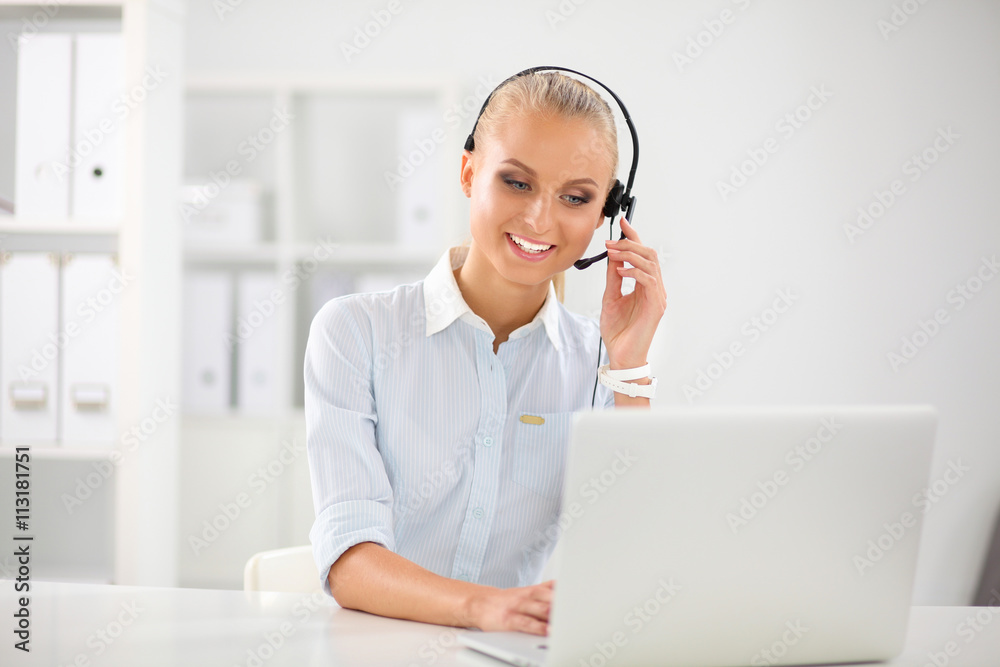 Close-up portrait of a customer service agent sitting at office Close-up portrait of a customer service agent sitting at office