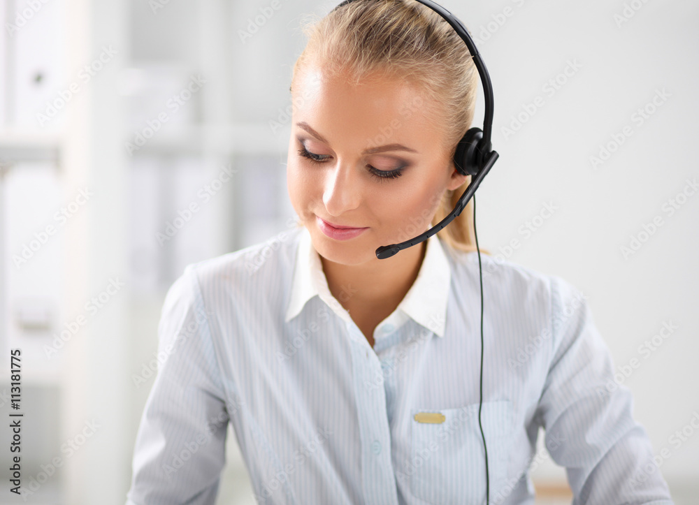 Close-up portrait of a customer service agent sitting at office Close-up portrait of a customer service agent sitting at office
