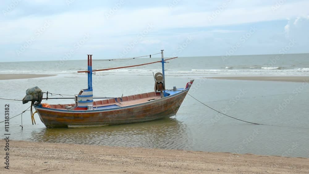 local fisherman boat moor at the beach when Low tide time cha-am thailand local fisherman boat moor at the beach when Low tide time cha-am thailand