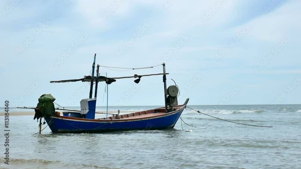 local fisherman boat moor at the beach when Low tide time cha-am thailand local fisherman boat moor at the beach when Low tide time cha-am thailand