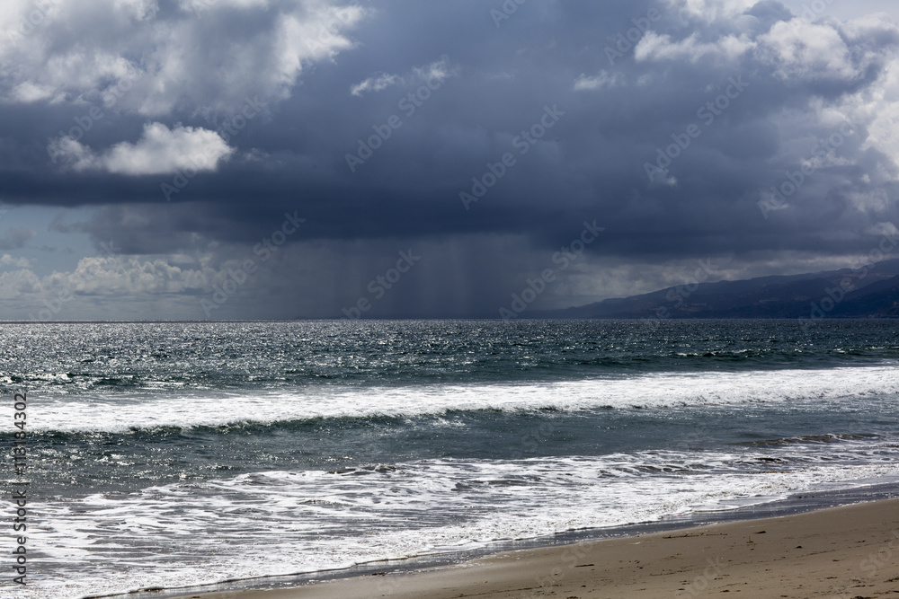 Pacific ocean during a storm. Beach landscape in the U.S. in bad weather. The ocean and waves during strong winds in United States, Santa Monica.