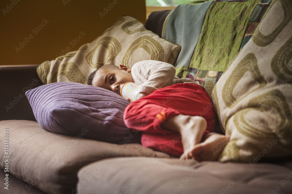 Boy (12-17 months) sleeping on sofa Boy (12-17 months) sleeping on sofa
