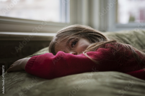 Girl (4-5) lying on bean bag